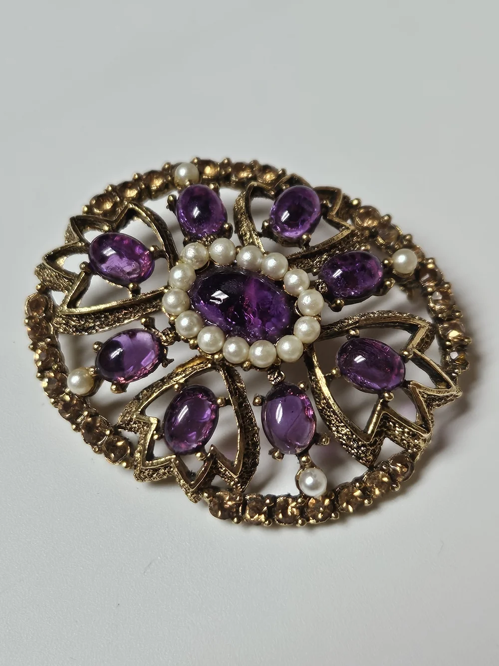 Gold-Tone Brooch with Purple Cabochons and Pearl Halo